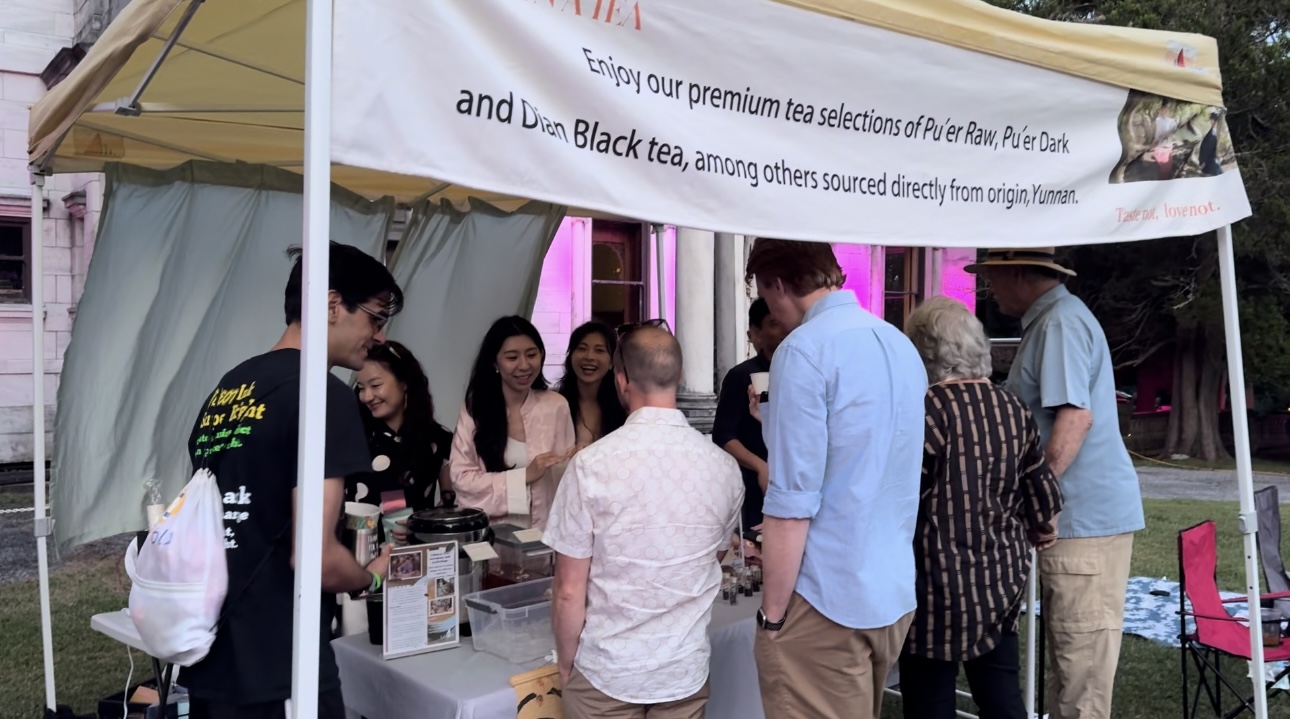 Guests visiting Upon a Tea's outdoor tea station at SUN/SETS